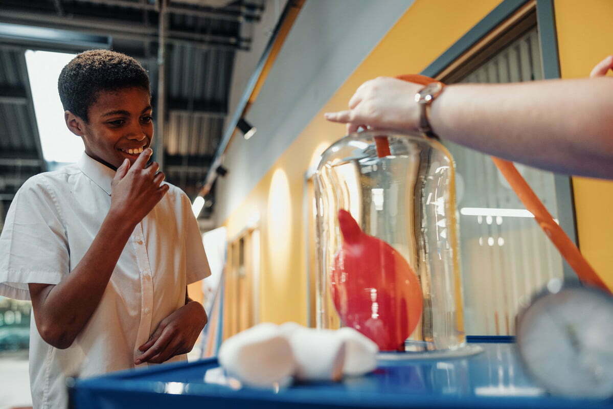 School pupil waching science experiment at Aberdeen Science Centre